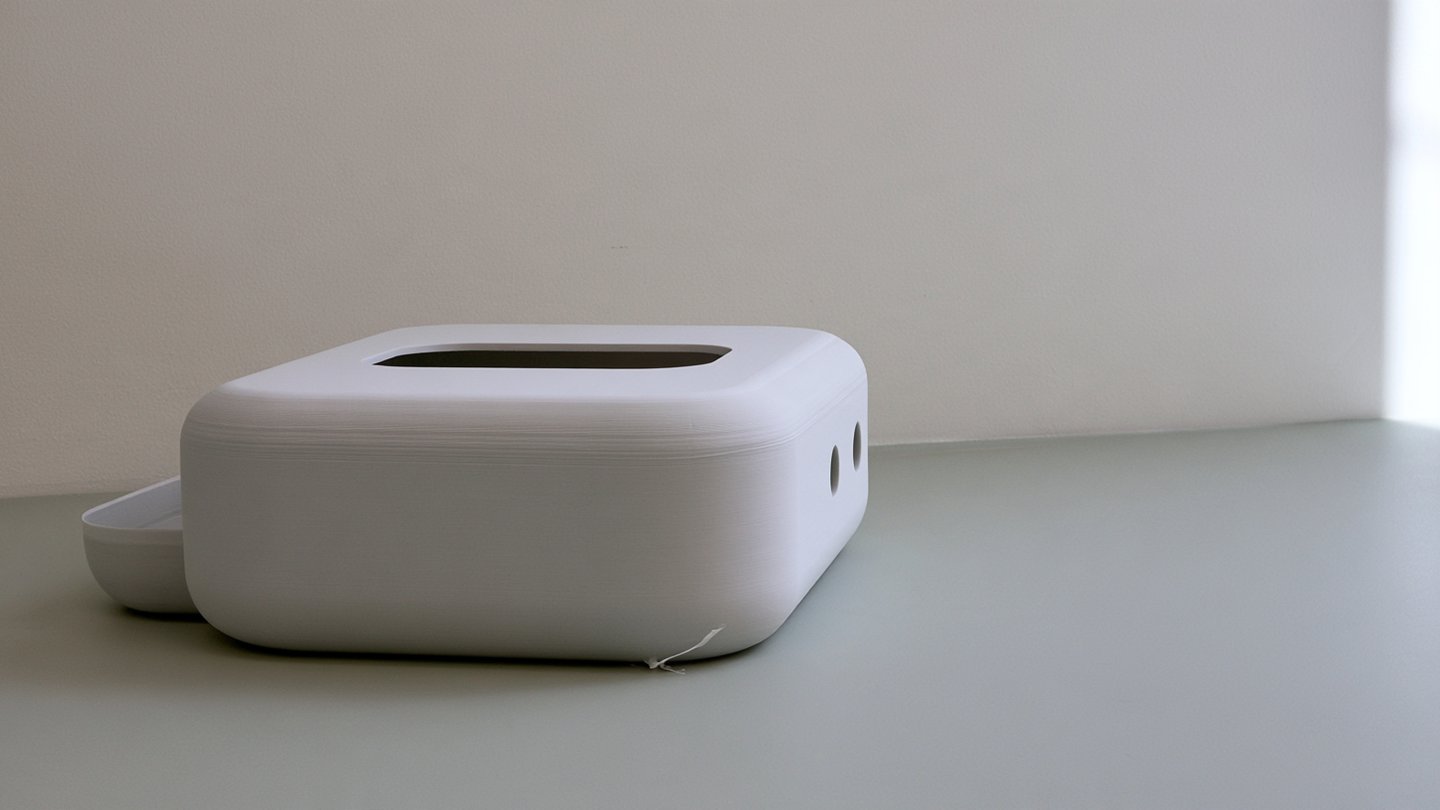 Large two-part grey plastic enclosure prototype with fine layer lines