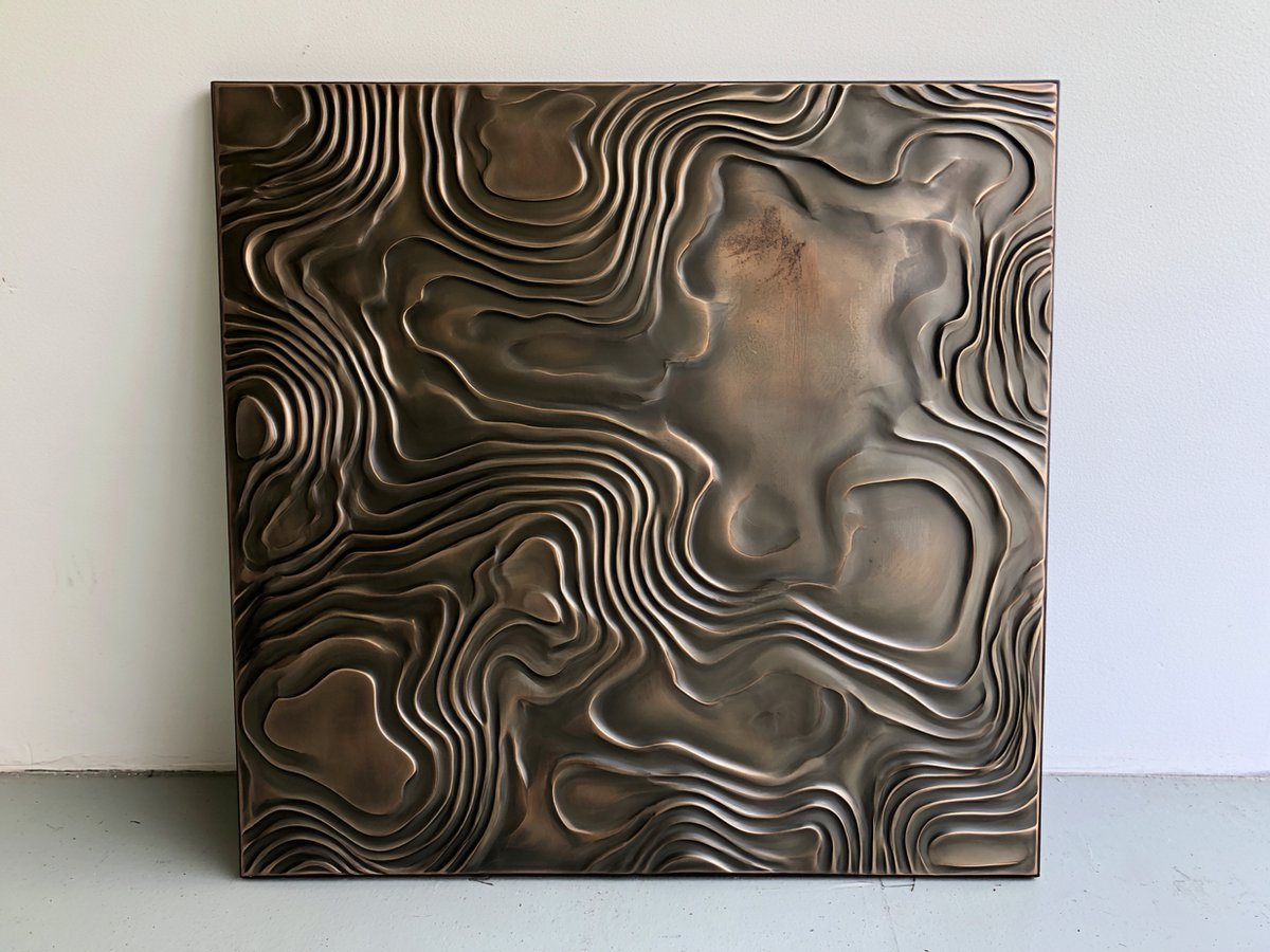 Liquid bronze topographic wall panel