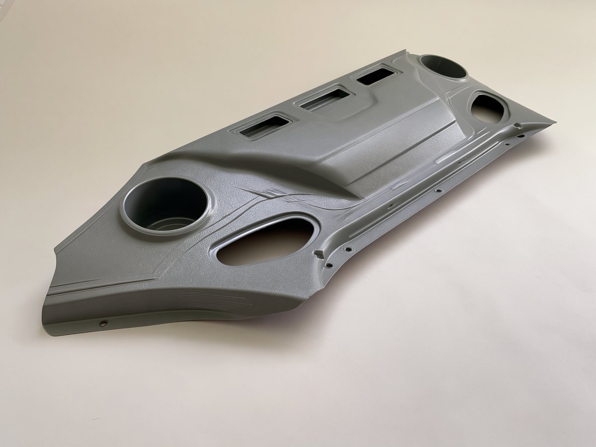 Grey textured ABS console cover with cup openings and switch openings