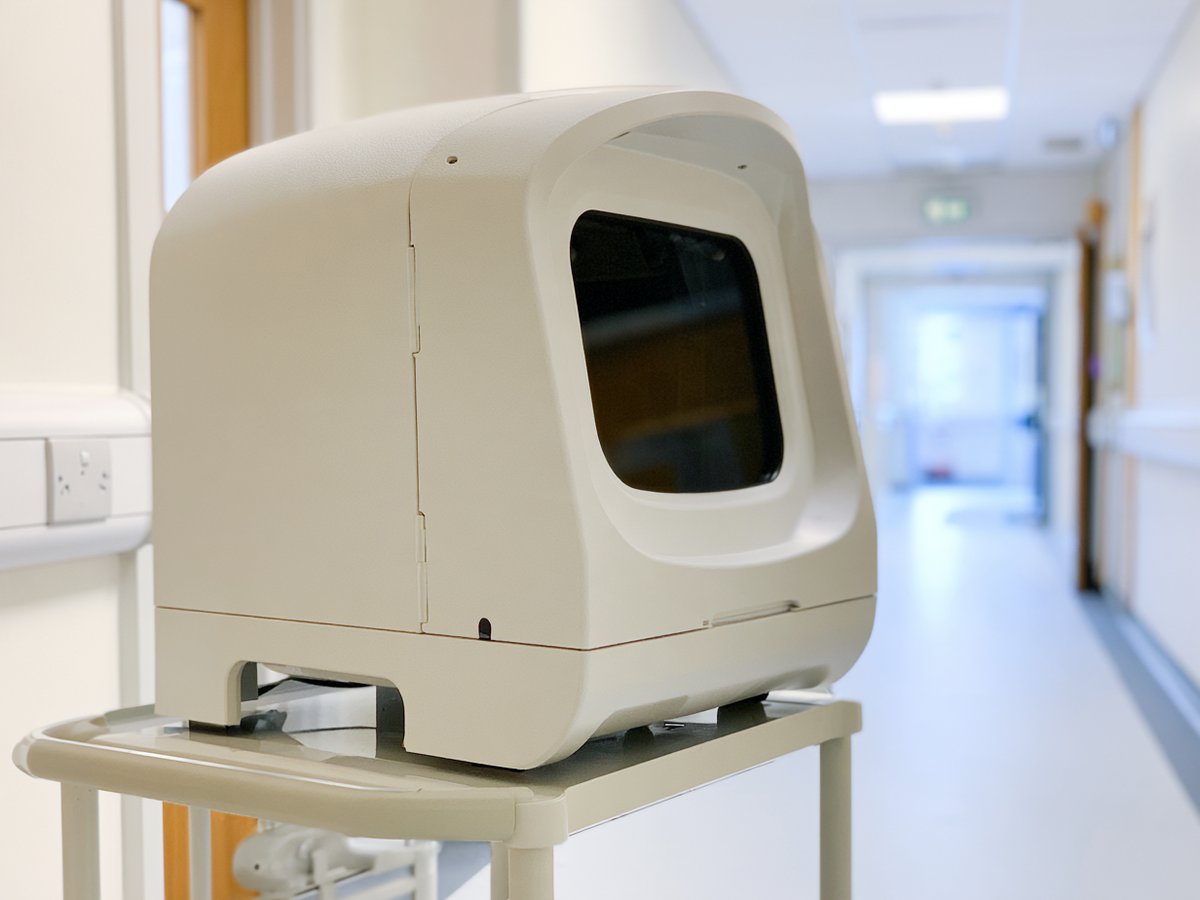 White equipment housing on a hospital trolley